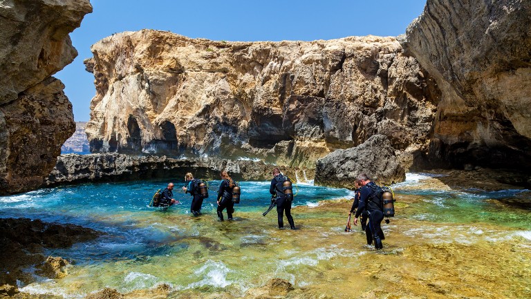 Group of people preparing to scuba dive