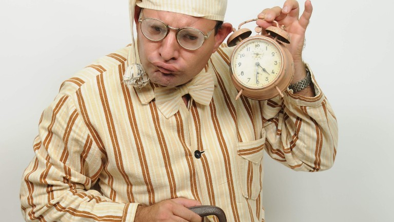 Man holding a clock