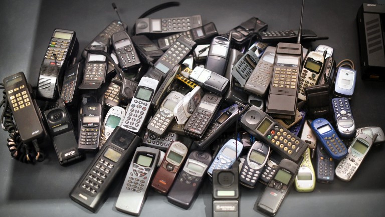 A bunch of old mobile phones
