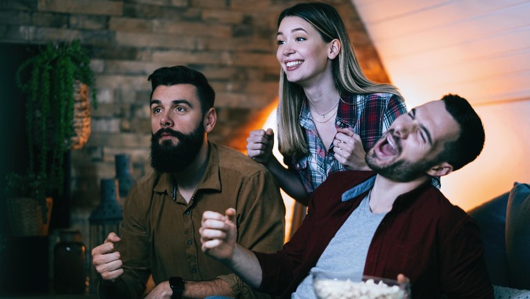 Group of young people watching tv
